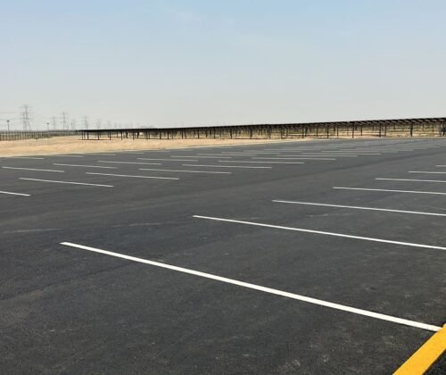 Asphalt road with fresh lane markings in open area