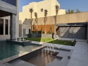 ESNAD Lawn and swimming pool in daylight