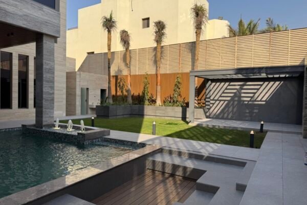 ESNAD Lawn and swimming pool in daylight