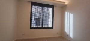 Residential room with window and minimal interior finish
