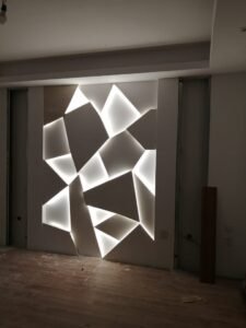 Luxury villa feature wall with geometric LED lighting design and modern interior detailing