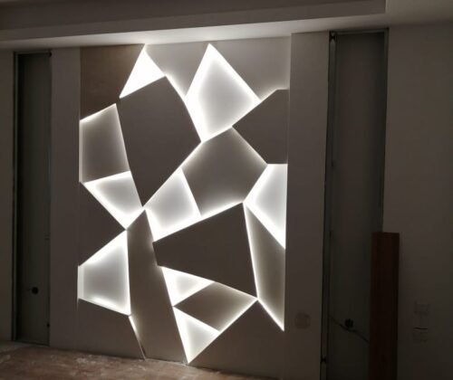 Luxury villa feature wall with geometric LED lighting design and modern interior detailing