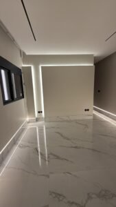 Modern luxury villa room with marble flooring and ambient LED strip lighting design