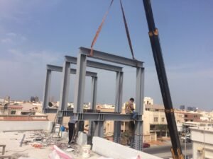 Steel structure installation using crane on site