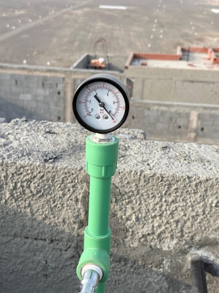 Pressure gauge on a water supply line during the pressure test
