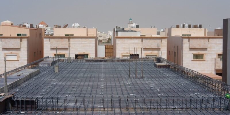 Steel reinforcement laid on a villa floor slab before the concrete pour in Jeddah